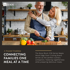 A man and woman smile while preparing a meal in a kitchen. The John Boos Boos Block CCB Series Large Reversible Wood Chopping Board, 2.25-Inch Thickness, 20