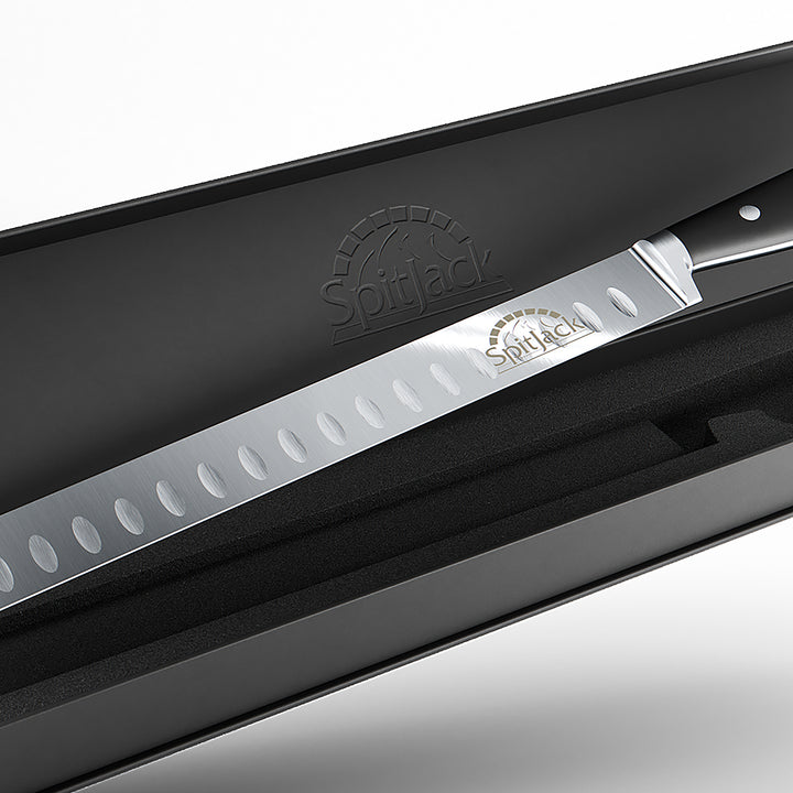 The SpitJack Deluxe Brisket Slicing Knife features an 11-inch Granton blade and black handle, packaged in a padded black box—ideal for competition barbecue or chef-level slicing.