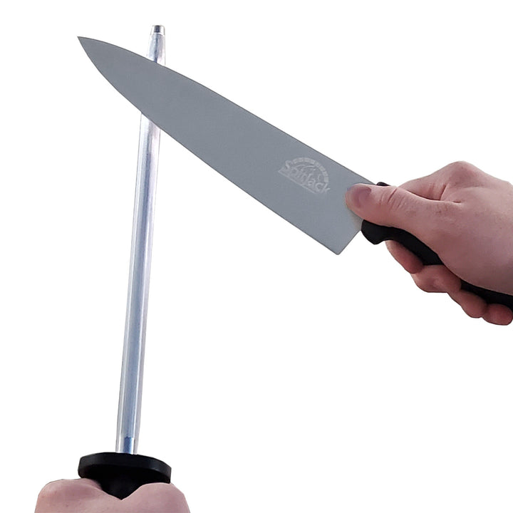 Description: A person holding a SpitJack 8 inch Chef Knife and Sharpening Hone Combo on top of a white background.