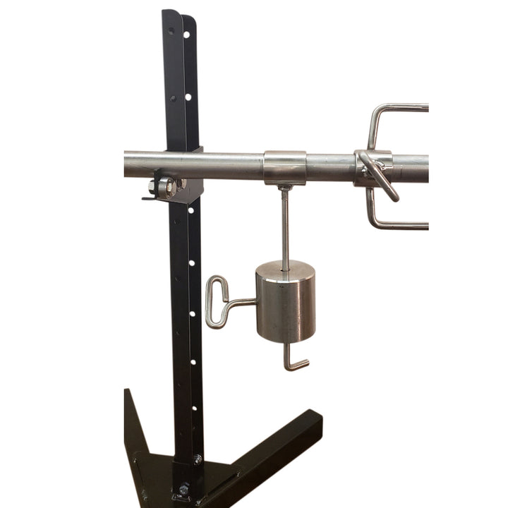 A SpitJack XB125C Whole Hog and Pig Spit Roast Rotisserie System with a bar attached to it.